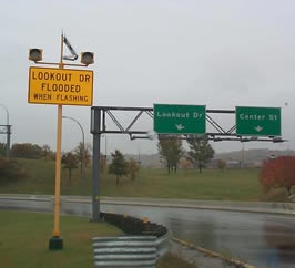 Wet road solar sensor warning system