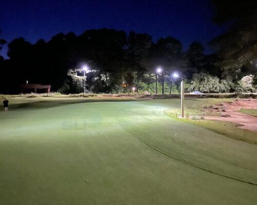 Solar lights along a golf course pathway