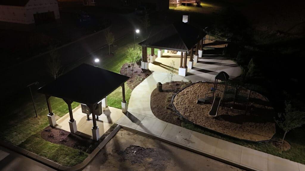 Solar-lit mailbox gazebos and pathway lighting in an HOA community